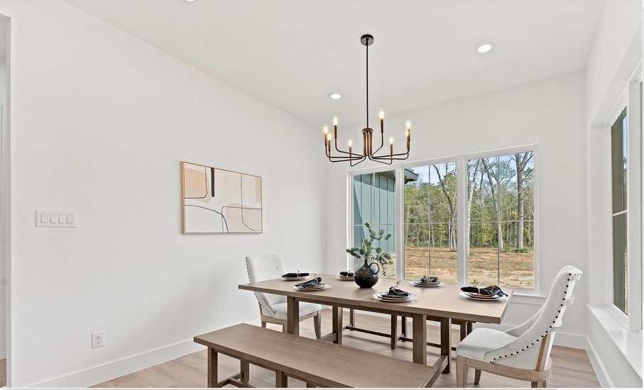15045 Tybee Lane Conroe, TX 77306 - Photo 9 of 41 a view of a dining room with furniture window and outside view