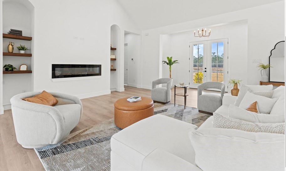 15045 Tybee Lane Conroe, TX 77306 - Photo 10 of 41 a living room with furniture and a flat screen tv