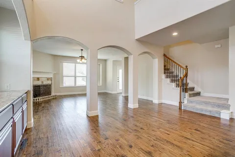 a view of livingroom with hardwood floor and a fireplace