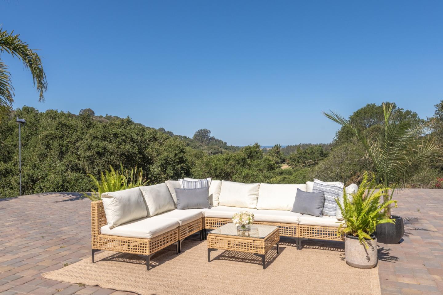 67 Tucker Road Watsonville, CA 95076 - Photo 3 of 32 a view of a terrace with couches and a potted plant on a table