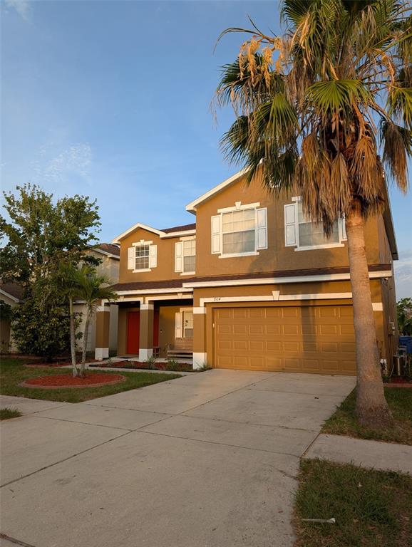 7524 Dragon Fly Loop Gibsonton, FL 33534 - Photo 12 of 55 a front view of a house with a garden