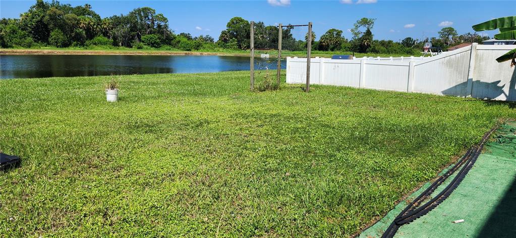 7524 Dragon Fly Loop Gibsonton, FL 33534 - Photo 13 of 55 a view of a lake with houses in the back