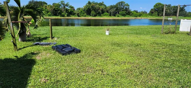 a view of a lake with houses in the back
