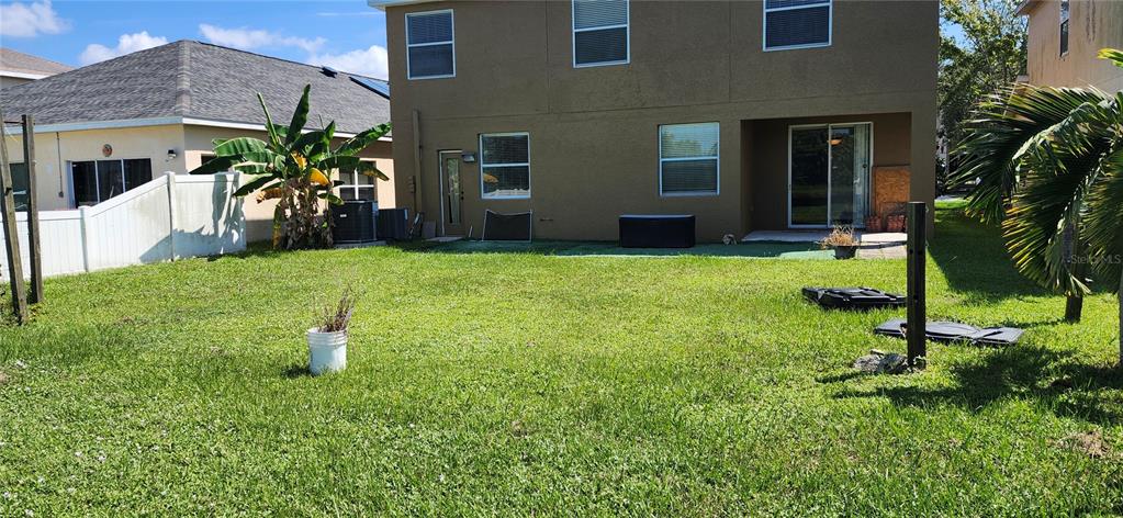 7524 Dragon Fly Loop Gibsonton, FL 33534 - Photo 19 of 55 a view of a house with a backyard
