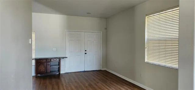 a kitchen with a refrigerator and a stove top oven