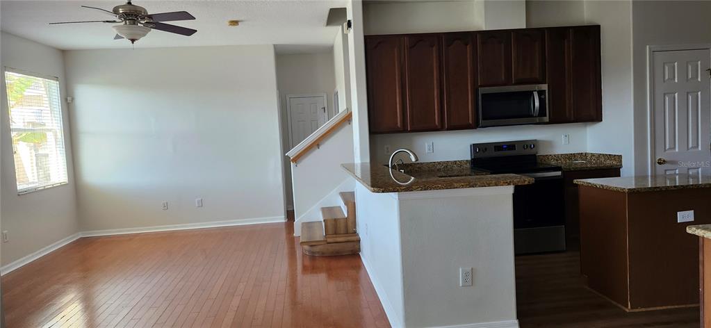 7524 Dragon Fly Loop Gibsonton, FL 33534 - Photo 24 of 55 a kitchen with a refrigerator stove and microwave
