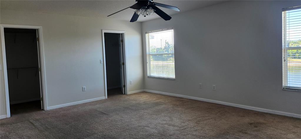 7524 Dragon Fly Loop Gibsonton, FL 33534 - Photo 33 of 55 an empty room with a window and a fan