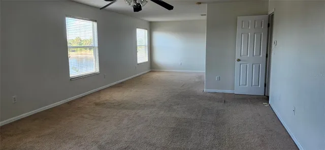 a view of a hallway with windows