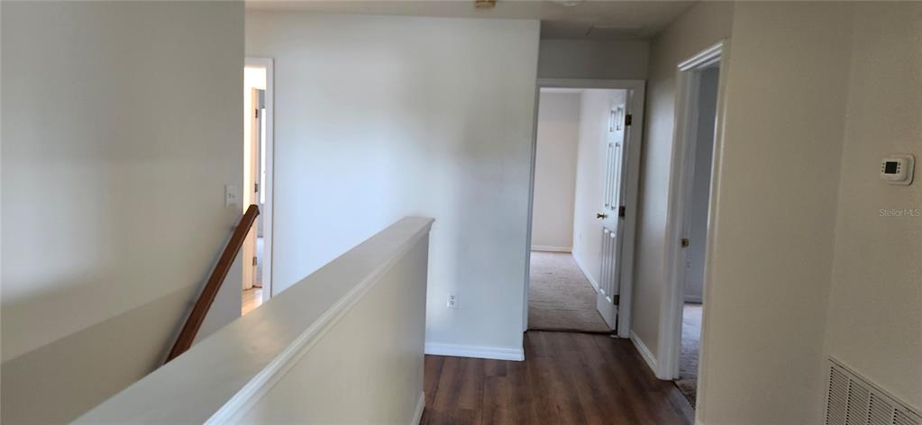 7524 Dragon Fly Loop Gibsonton, FL 33534 - Photo 43 of 55 a view of a hallway with wooden floor and entryway