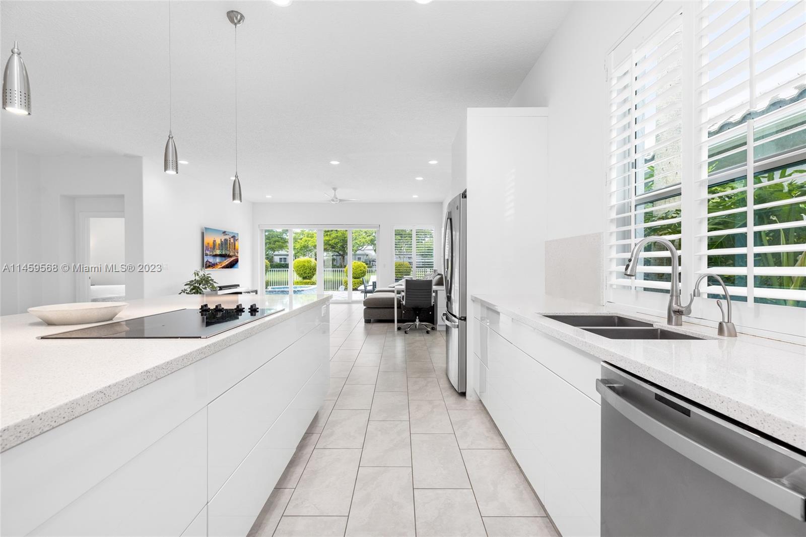 5675 Regency Circle West Boca Raton, FL 33496 - Photo 12 of 74 a large white kitchen with a large window