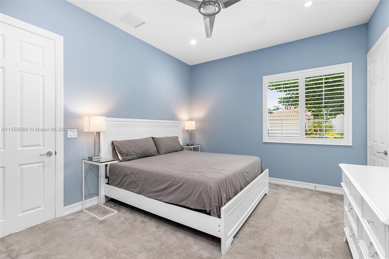 5675 Regency Circle West Boca Raton, FL 33496 - Photo 23 of 74 a bed room with a bed and a window
