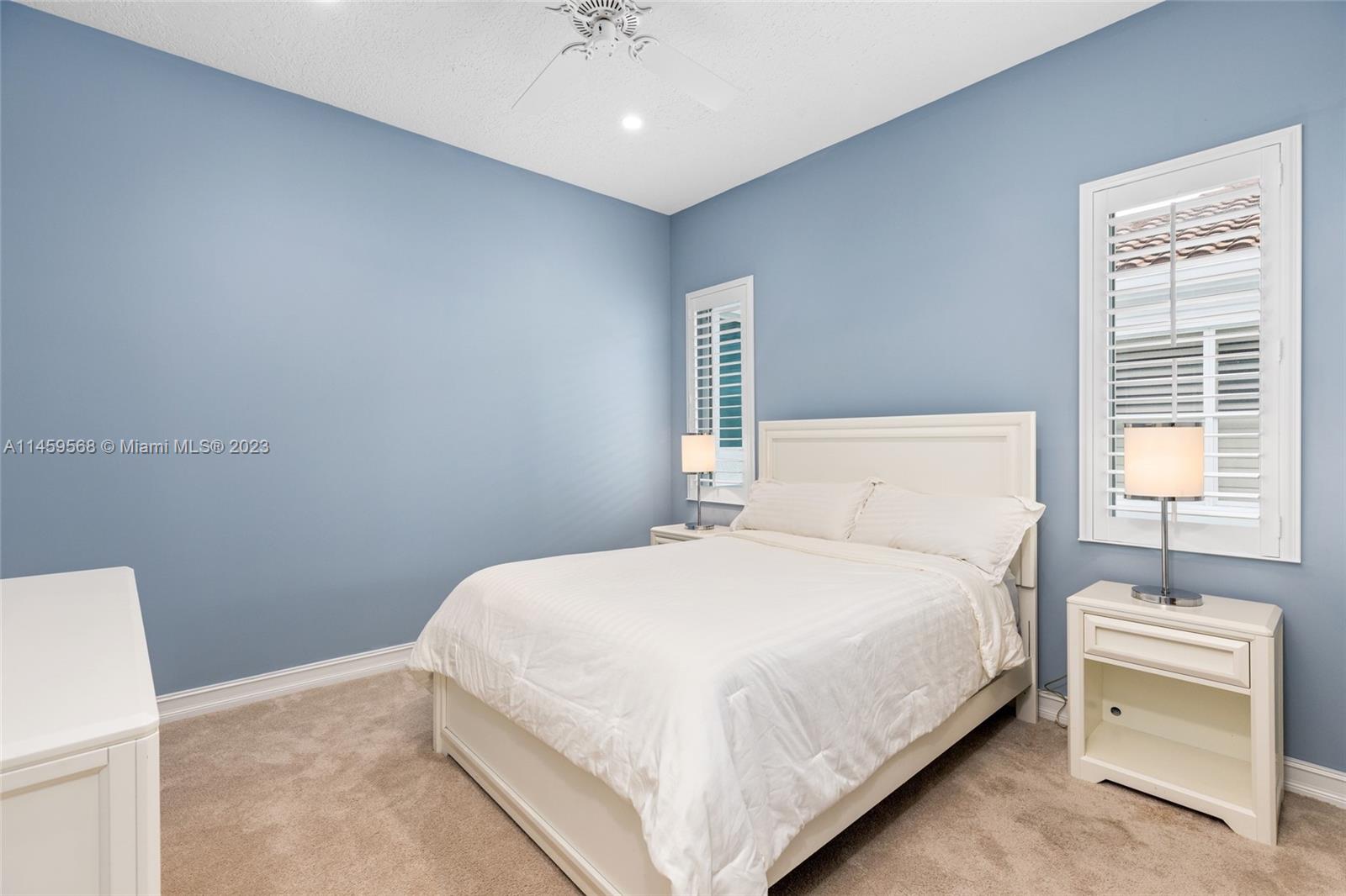 5675 Regency Circle West Boca Raton, FL 33496 - Photo 27 of 74 a bedroom with a bed and a window