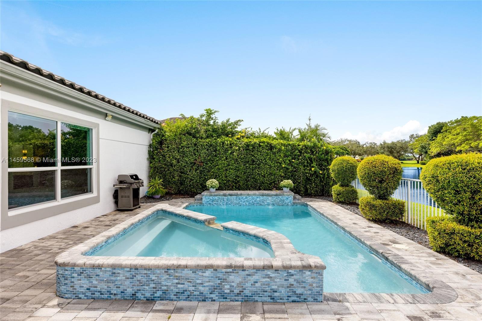 5675 Regency Circle West Boca Raton, FL 33496 - Photo 33 of 74 a view of a house with basketball ground and potted plants