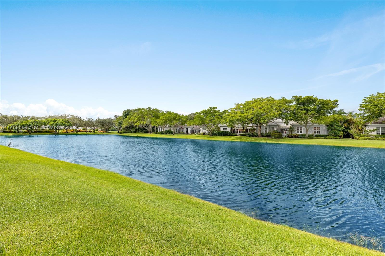 5675 Regency Circle West Boca Raton, FL 33496 - Photo 38 of 74 a view of a lake with houses in the background