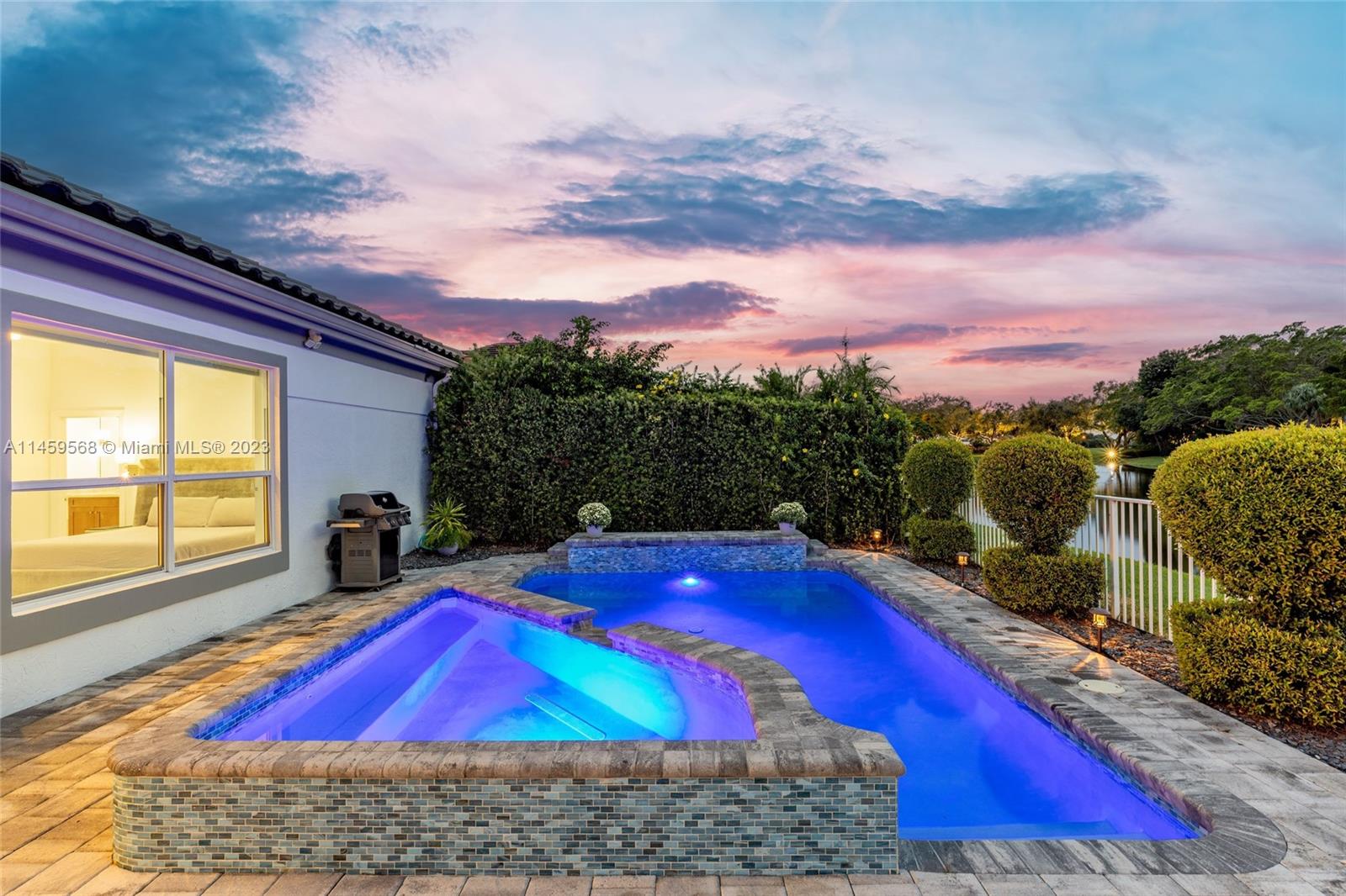 5675 Regency Circle West Boca Raton, FL 33496 - Photo 43 of 74 a view of a pool in the backyard of house