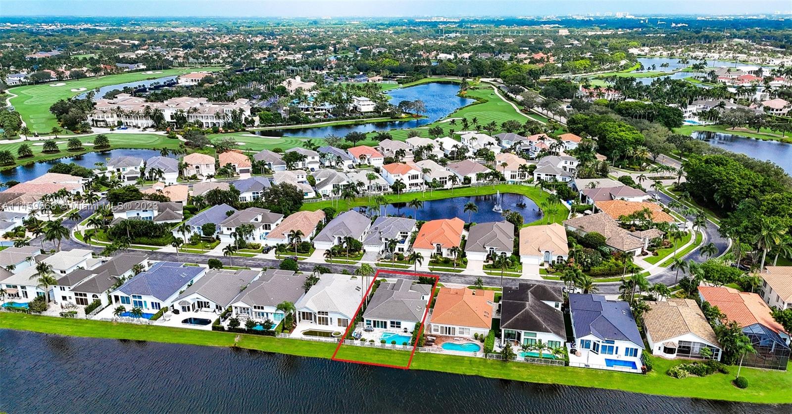 5675 Regency Circle West Boca Raton, FL 33496 - Photo 45 of 74 an aerial view of a city with lots of residential buildings ocean and mountain view in back