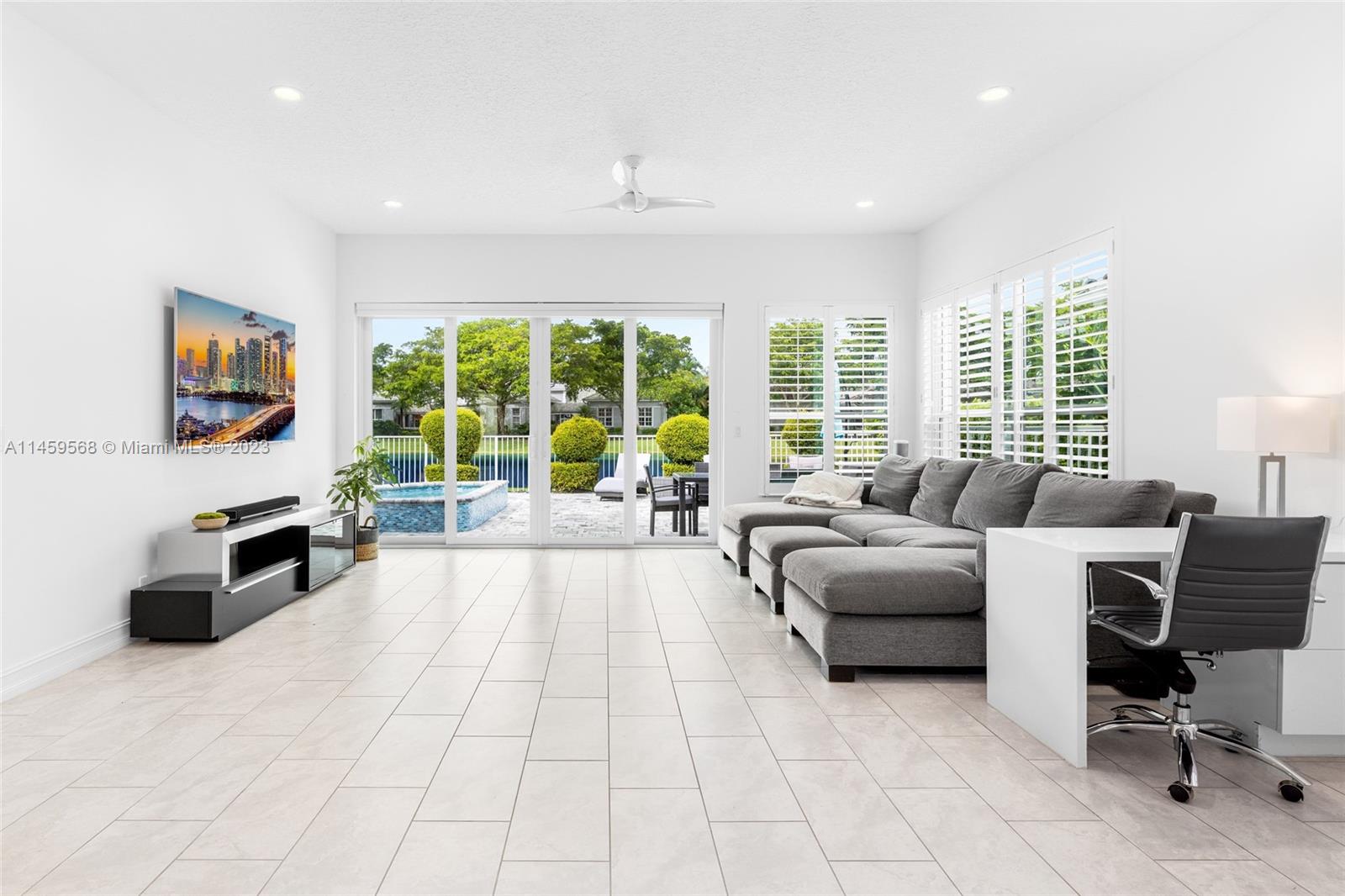 5675 Regency Circle West Boca Raton, FL 33496 - Photo 6 of 74 a living room with furniture and large windows