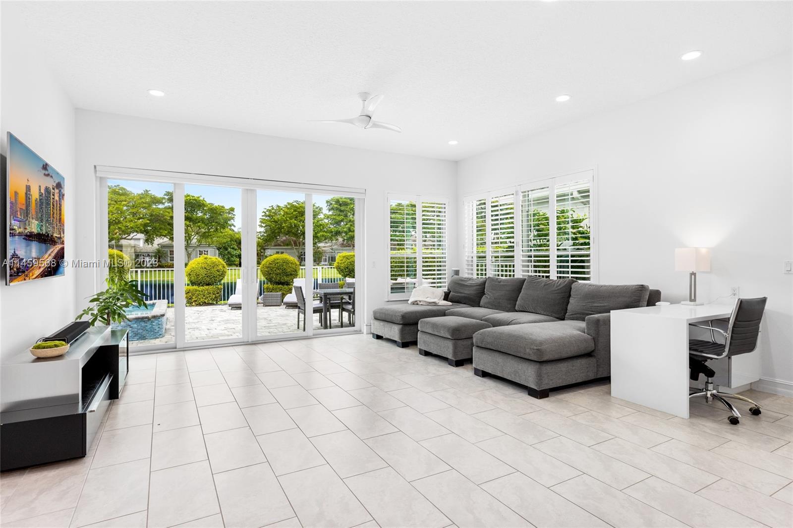 5675 Regency Circle West Boca Raton, FL 33496 - Photo 9 of 74 a living room with furniture and a flat screen tv