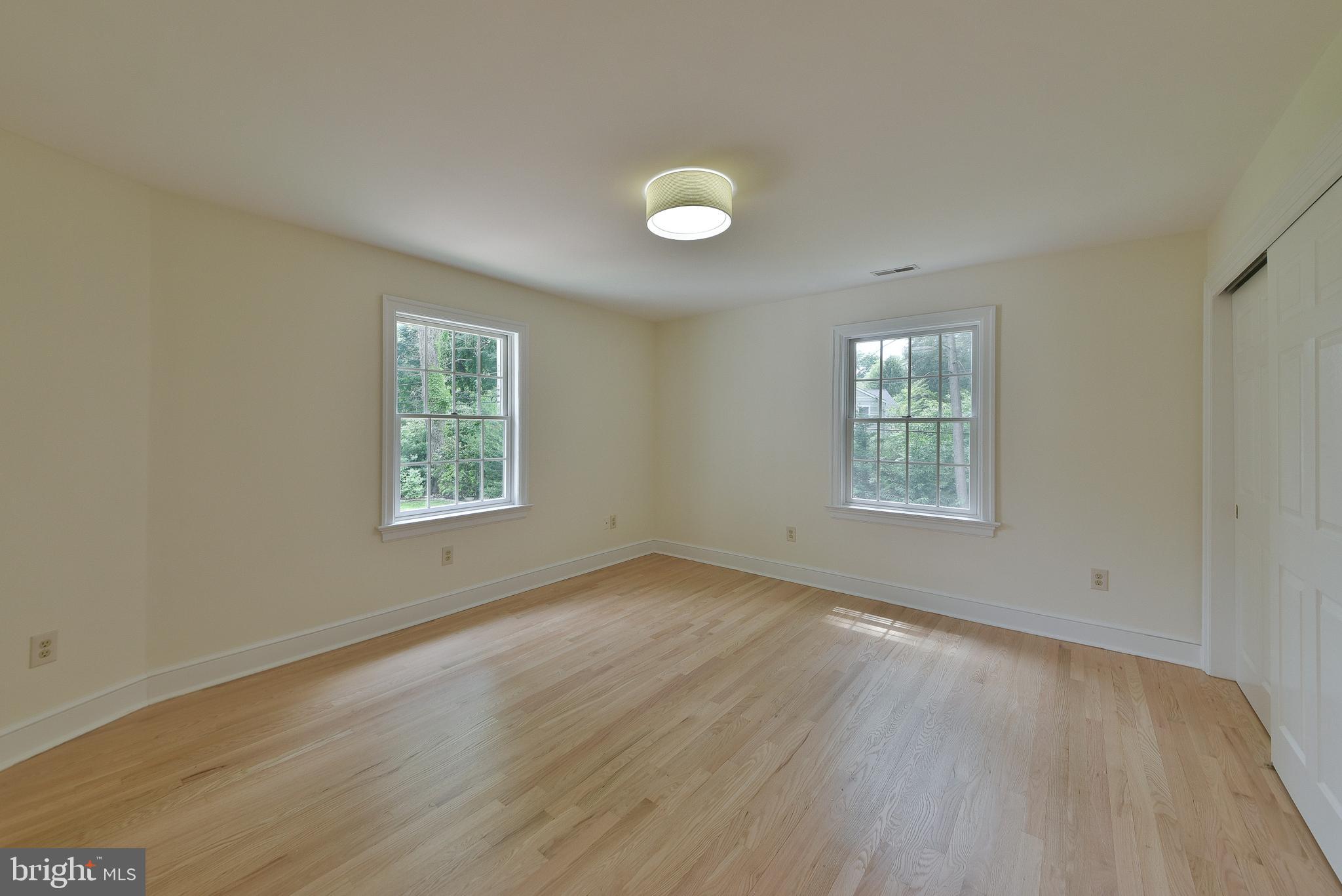 1223 Evergreen Road Yardley, PA 19067 - Photo 50 of 68 an empty room with wooden floor and windows