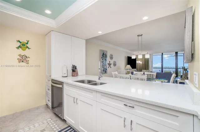 a view of living room with granite countertop furniture and a flat screen tv