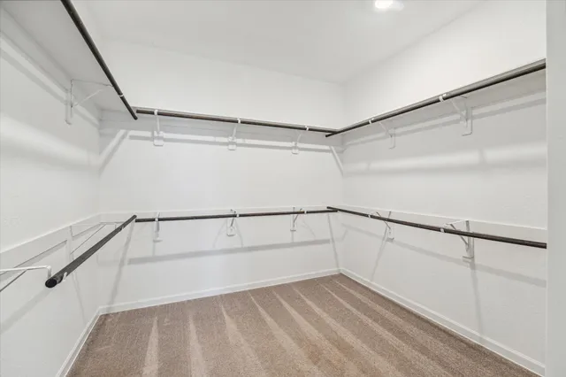 a view of an empty walk in closet