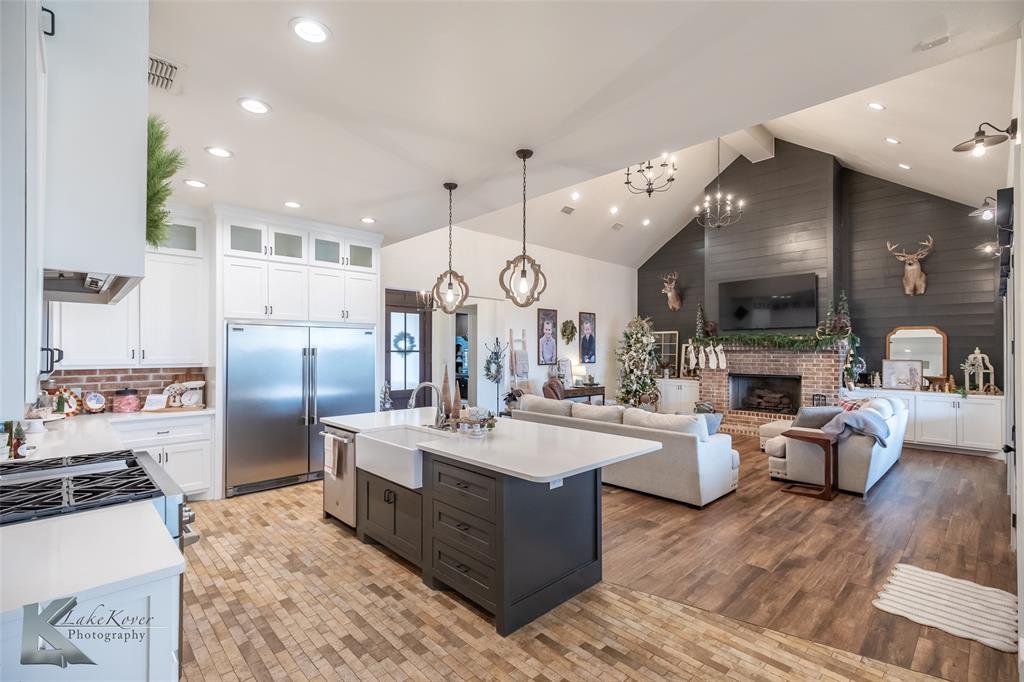 622 Ranch Road Buffalo Gap, TX 79508 - Photo 12 of 40 a large kitchen with stainless steel appliances lots of counter space