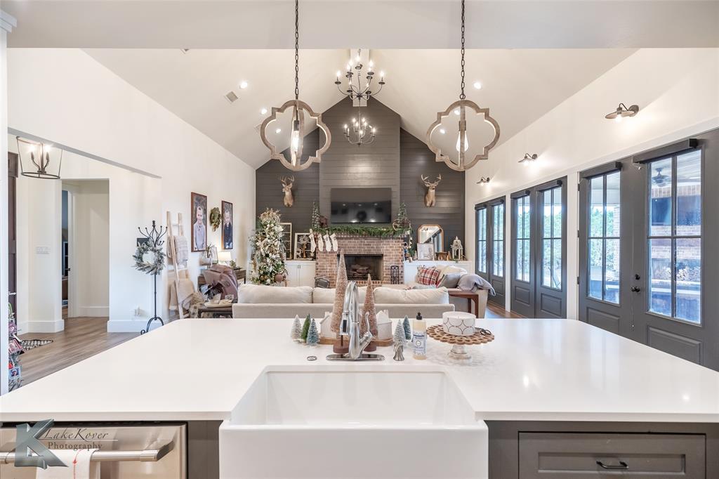 622 Ranch Road Buffalo Gap, TX 79508 - Photo 13 of 40 a large kitchen with a table and chairs