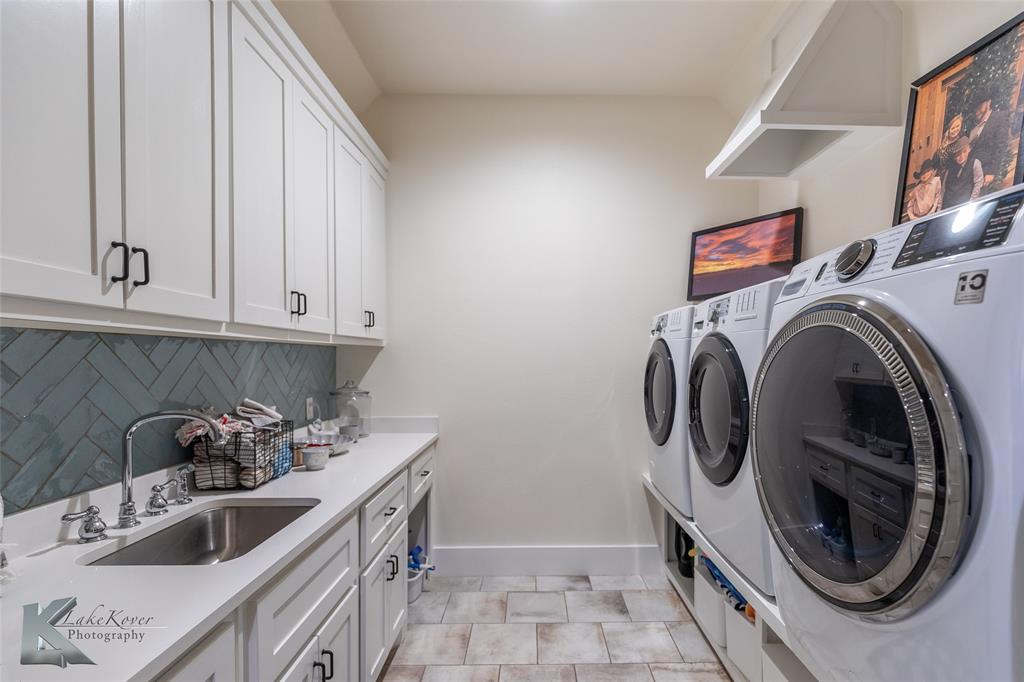 622 Ranch Road Buffalo Gap, TX 79508 - Photo 21 of 40 a kitchen with stainless steel appliances granite countertop a sink and a stove top oven