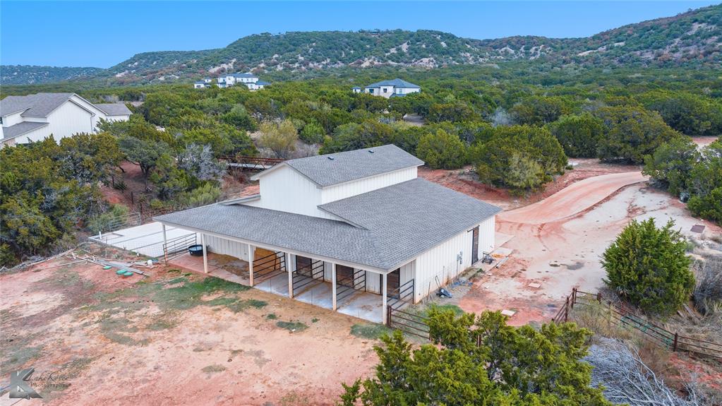 622 Ranch Road Buffalo Gap, TX 79508 - Photo 39 of 40 an aerial view of a house with a garden