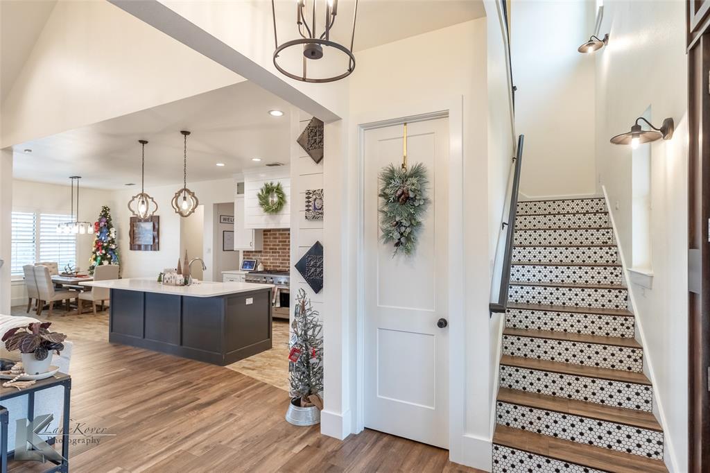 622 Ranch Road Buffalo Gap, TX 79508 - Photo 5 of 40 a view of kitchen with granite countertop stainless steel appliances and wooden floor