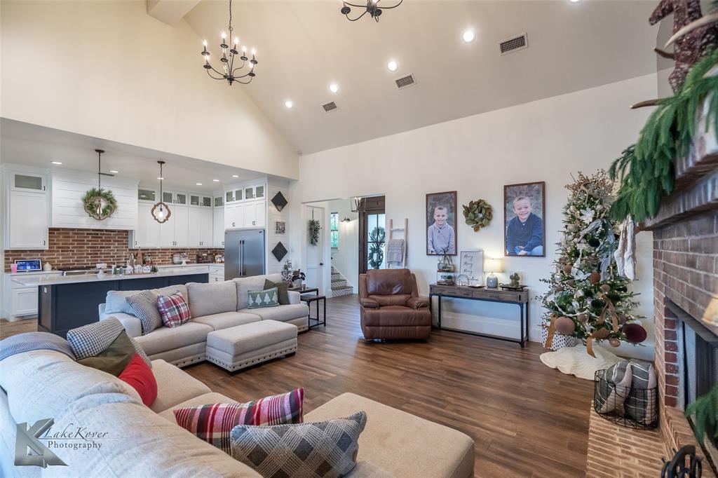 622 Ranch Road Buffalo Gap, TX 79508 - Photo 8 of 40 a living room with furniture or couch and a fireplace