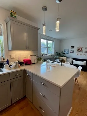 a kitchen with sink and cabinets