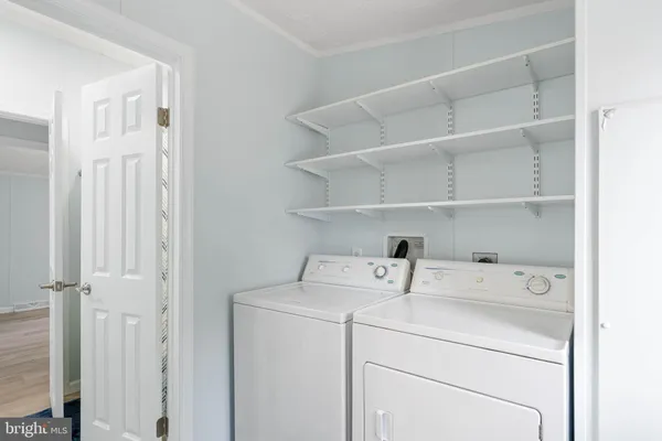 a view of a house with wooden deck