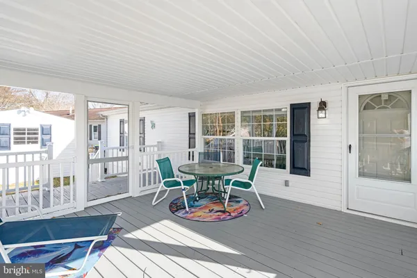 an aerial view of residential building and lake