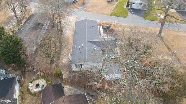 an aerial view of a house a yard and lake view