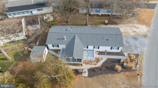 an aerial view of a house with a garden