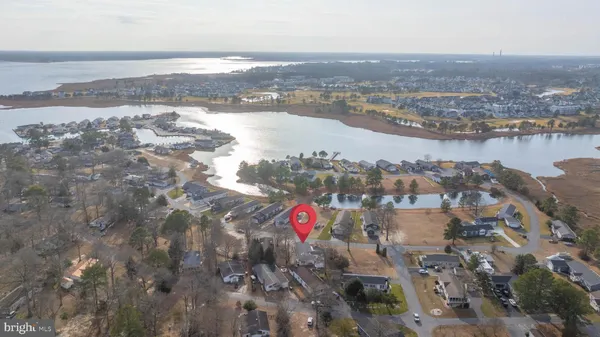 an aerial view of a house with a lake view
