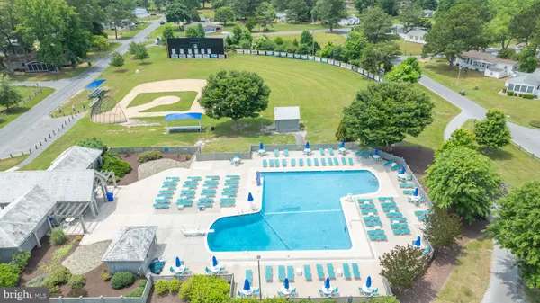 a aerial view of a chairs and table on the terrace