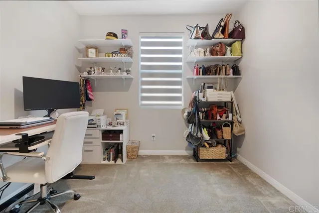 a view of a workspace with furniture