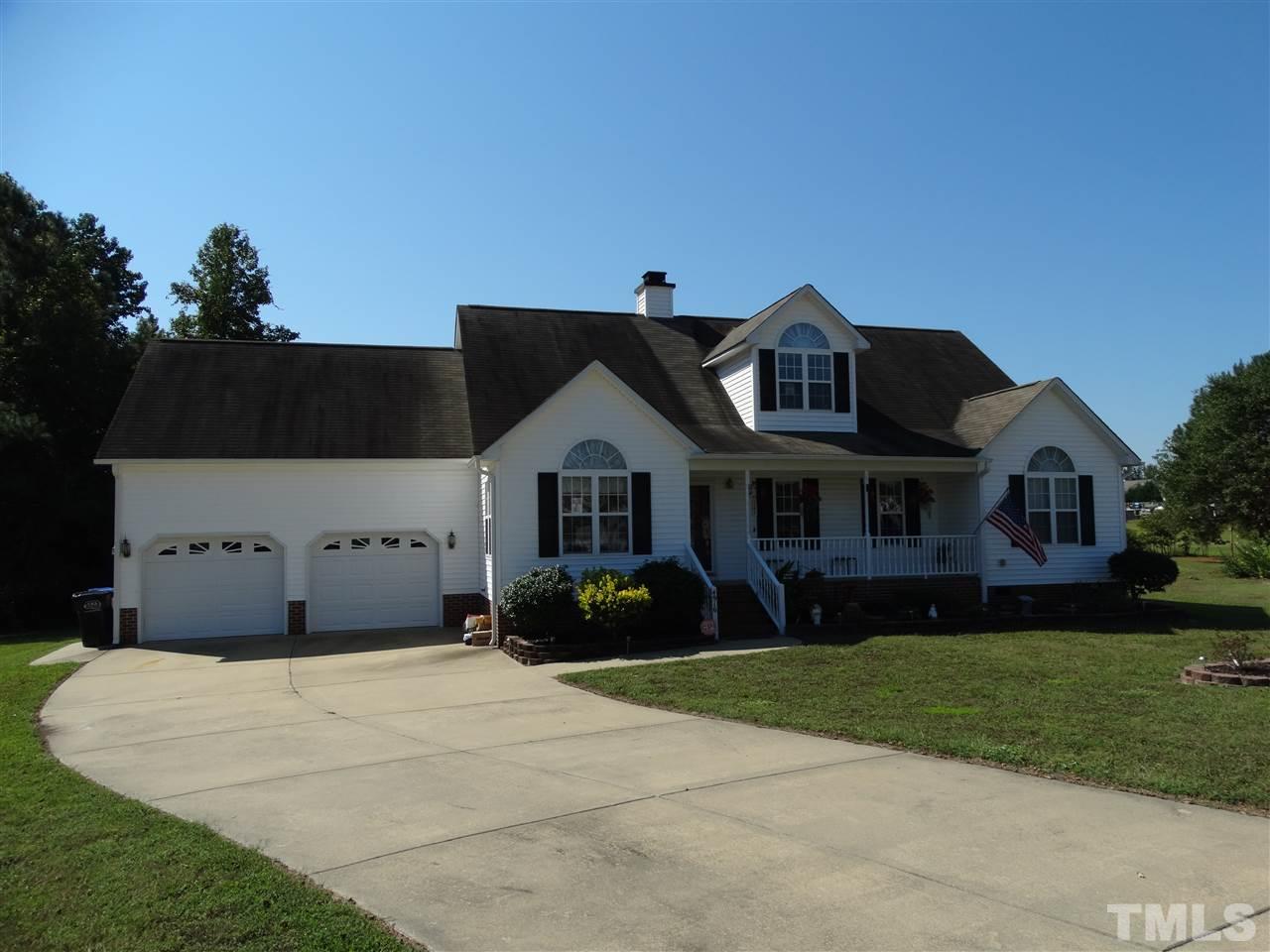 4916 Topstone Road Raleigh, NC 27603 - Photo 2 of 25 a front view of a house with a garden