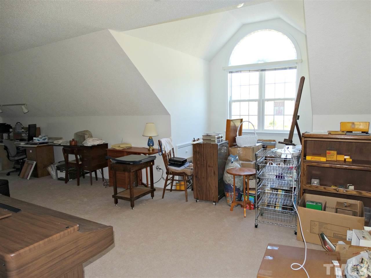4916 Topstone Road Raleigh, NC 27603 - Photo 20 of 25 a view of a livingroom with furniture and window