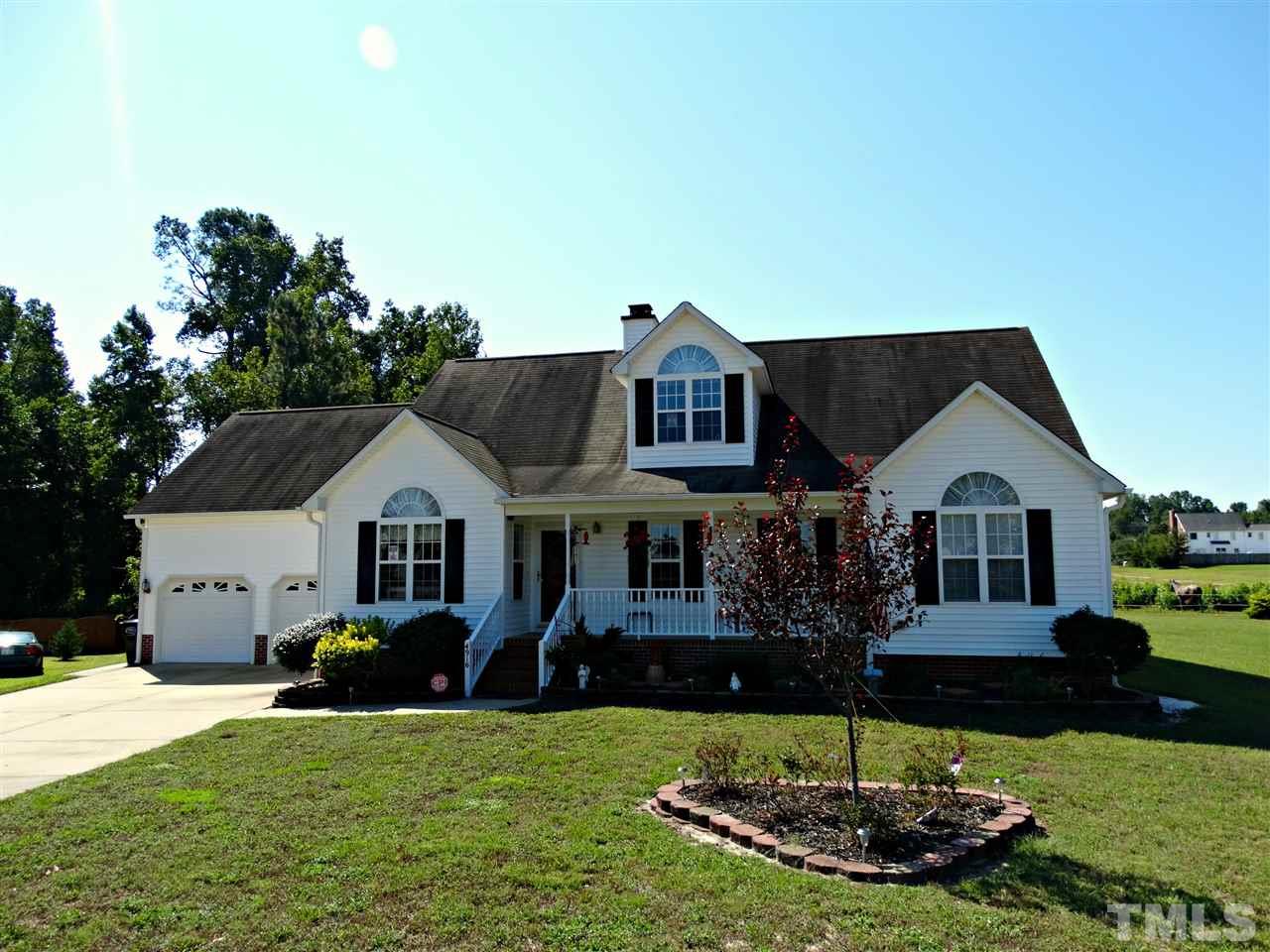 4916 Topstone Road Raleigh, NC 27603 - Photo 3 of 25 a front view of a house with a yard