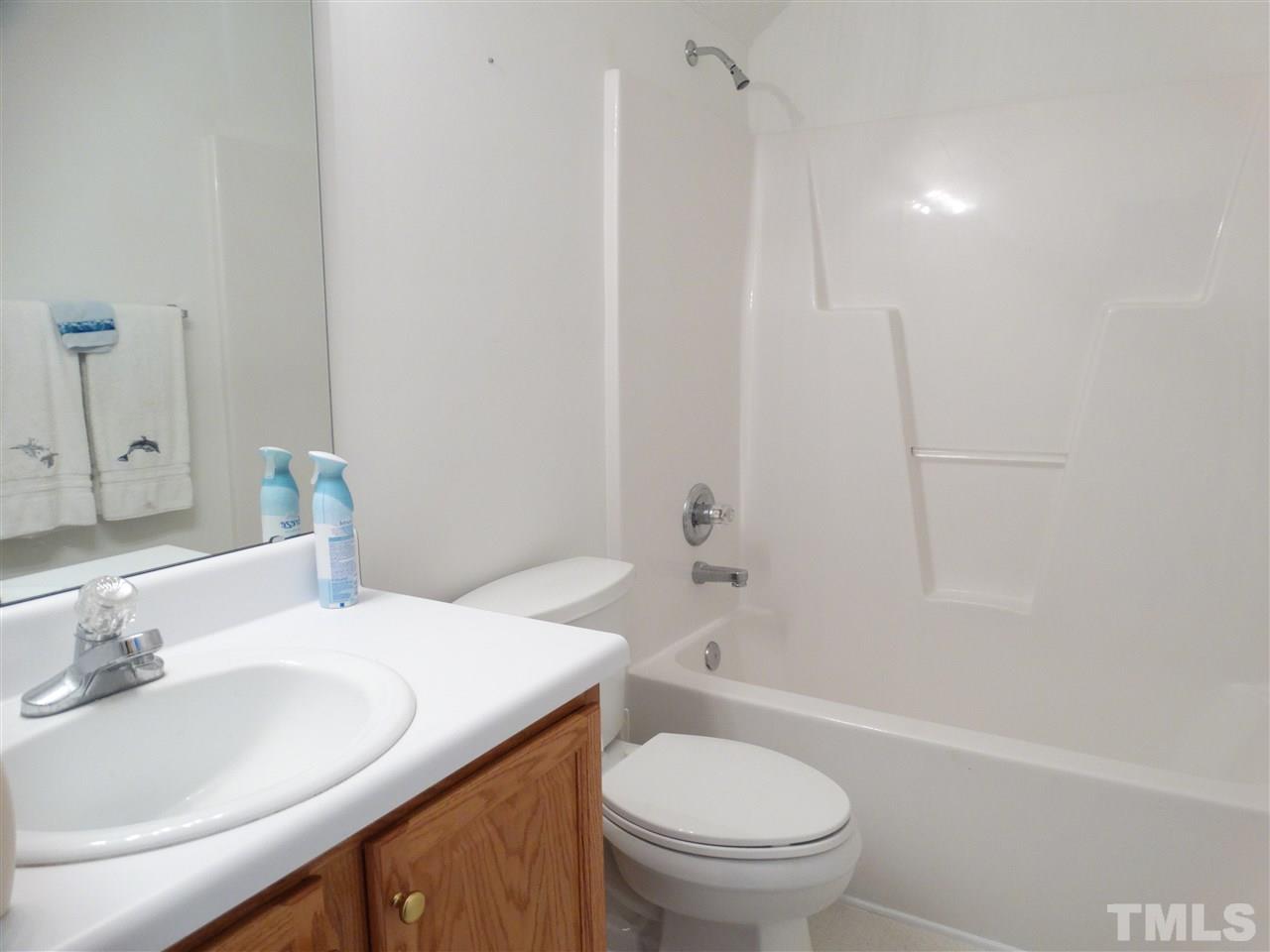 4916 Topstone Road Raleigh, NC 27603 - Photo 22 of 25 a bathroom with a sink and a toilet