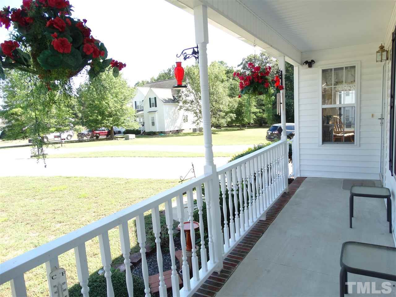 4916 Topstone Road Raleigh, NC 27603 - Photo 5 of 25 a view of a porch and flowers