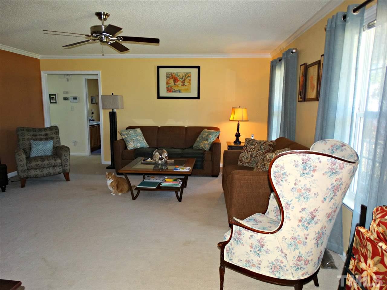4916 Topstone Road Raleigh, NC 27603 - Photo 10 of 25 a living room with furniture and a window