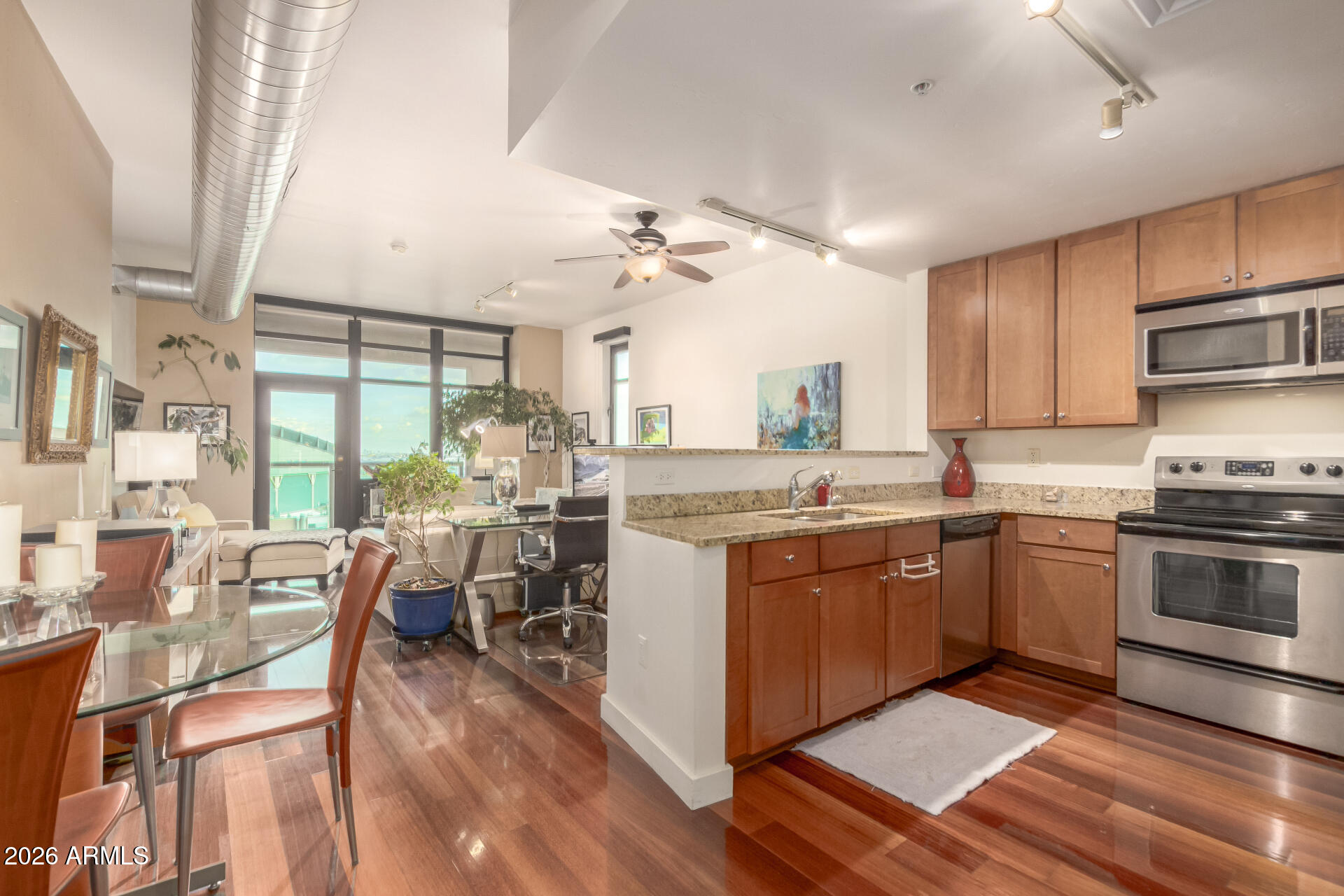 310 South 4th Street, Unit 1109 Phoenix, AZ 85004 - Photo 12 of 36 a kitchen with a sink appliances and cabinets