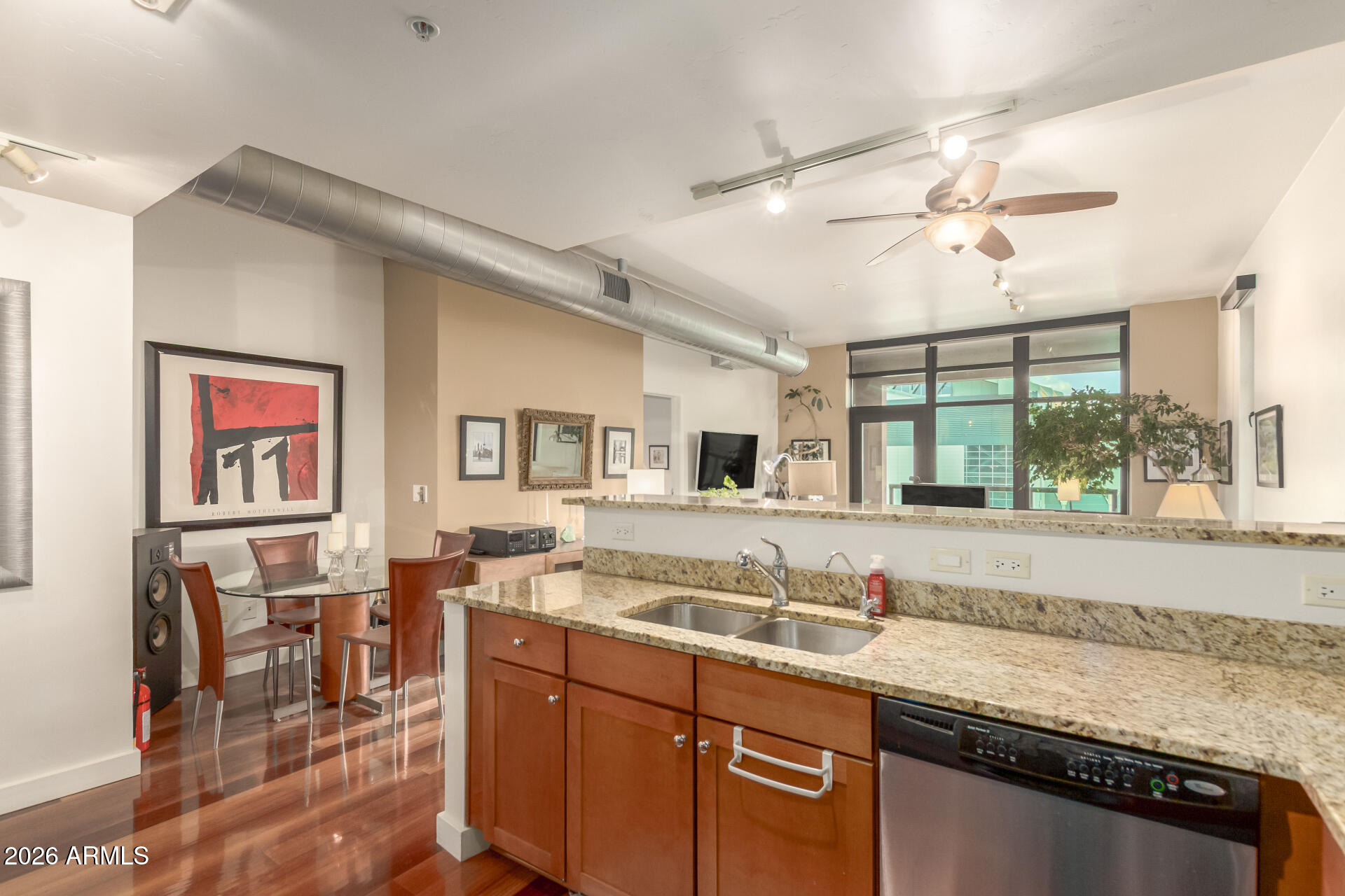 310 South 4th Street, Unit 1109 Phoenix, AZ 85004 - Photo 13 of 36 a spacious bathroom with a granite countertop sink and a large mirror