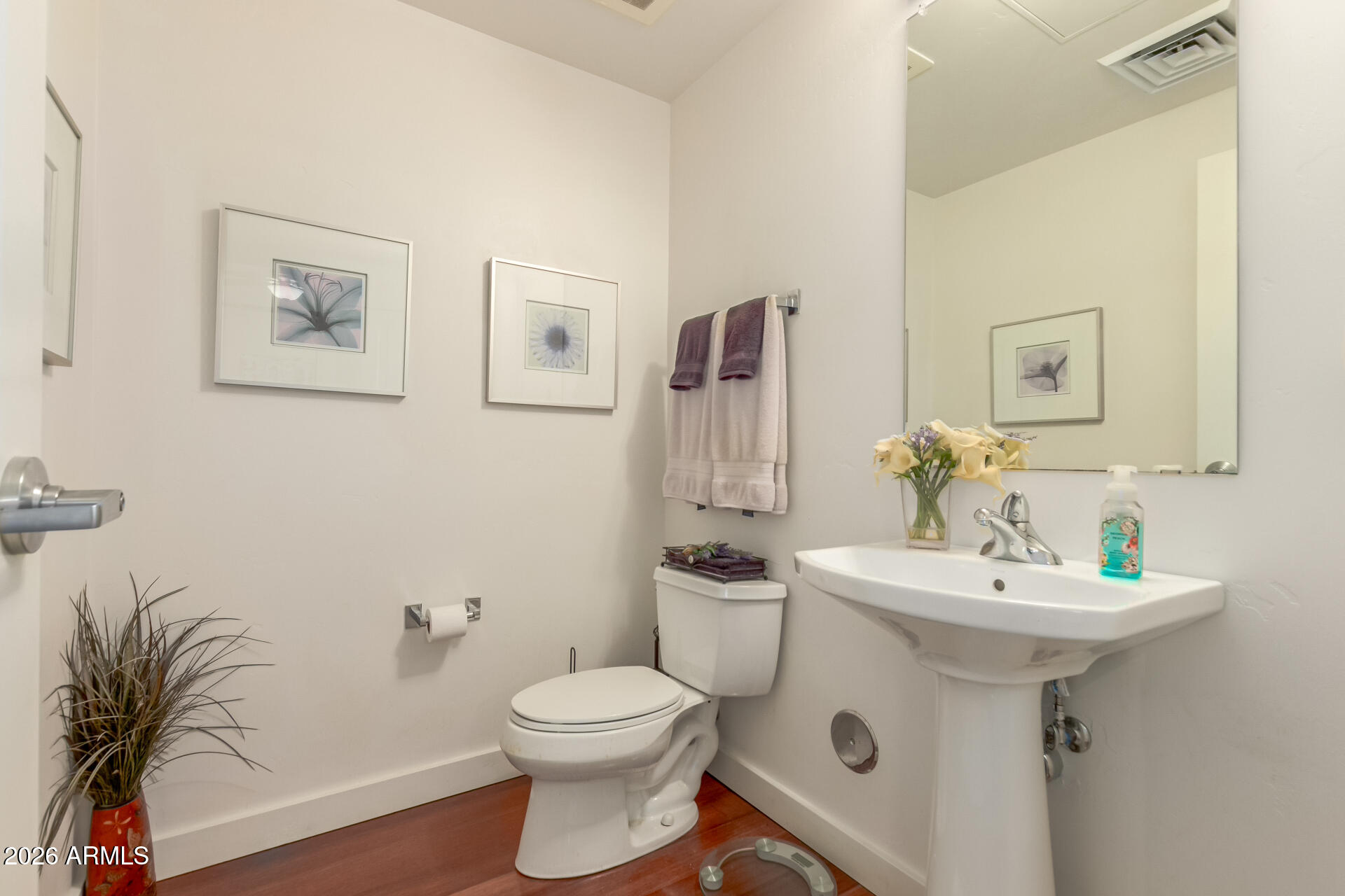 310 South 4th Street, Unit 1109 Phoenix, AZ 85004 - Photo 14 of 36 a bathroom with a sink toilet and mirror