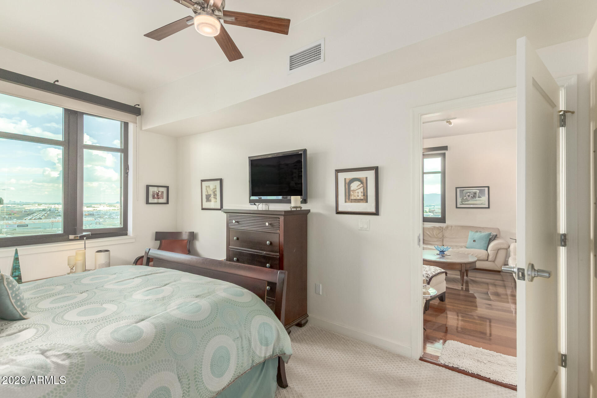 310 South 4th Street, Unit 1109 Phoenix, AZ 85004 - Photo 17 of 36 a bedroom with a bed and a television