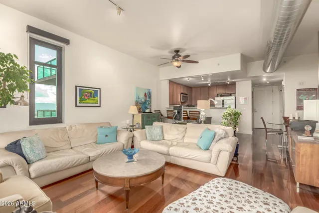 a living room with furniture and a window